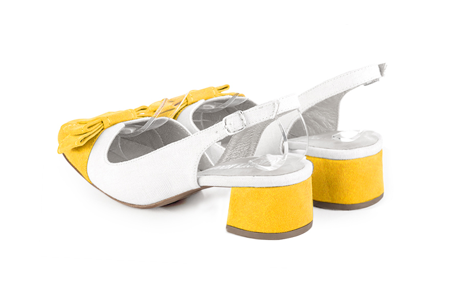 French elegance and refinement for these yellow and pure white dress slingback shoes, with a knot, 
                available in many subtle leather and colour combinations. The pretty French spirit of this beautiful pump will accompany your steps nicely and comfortably.
To be personalized or not, with your materials and colors.  
                Matching clutches for parties, ceremonies and weddings.   
                You can customize these shoes to perfectly match your tastes or needs, and have a unique model.  
                Choice of leathers, colours, knots and heels. 
                Wide range of materials and shades carefully chosen.  
                Rich collection of flat, low, mid and high heels.  
                Small and large shoe sizes - Florence KOOIJMAN